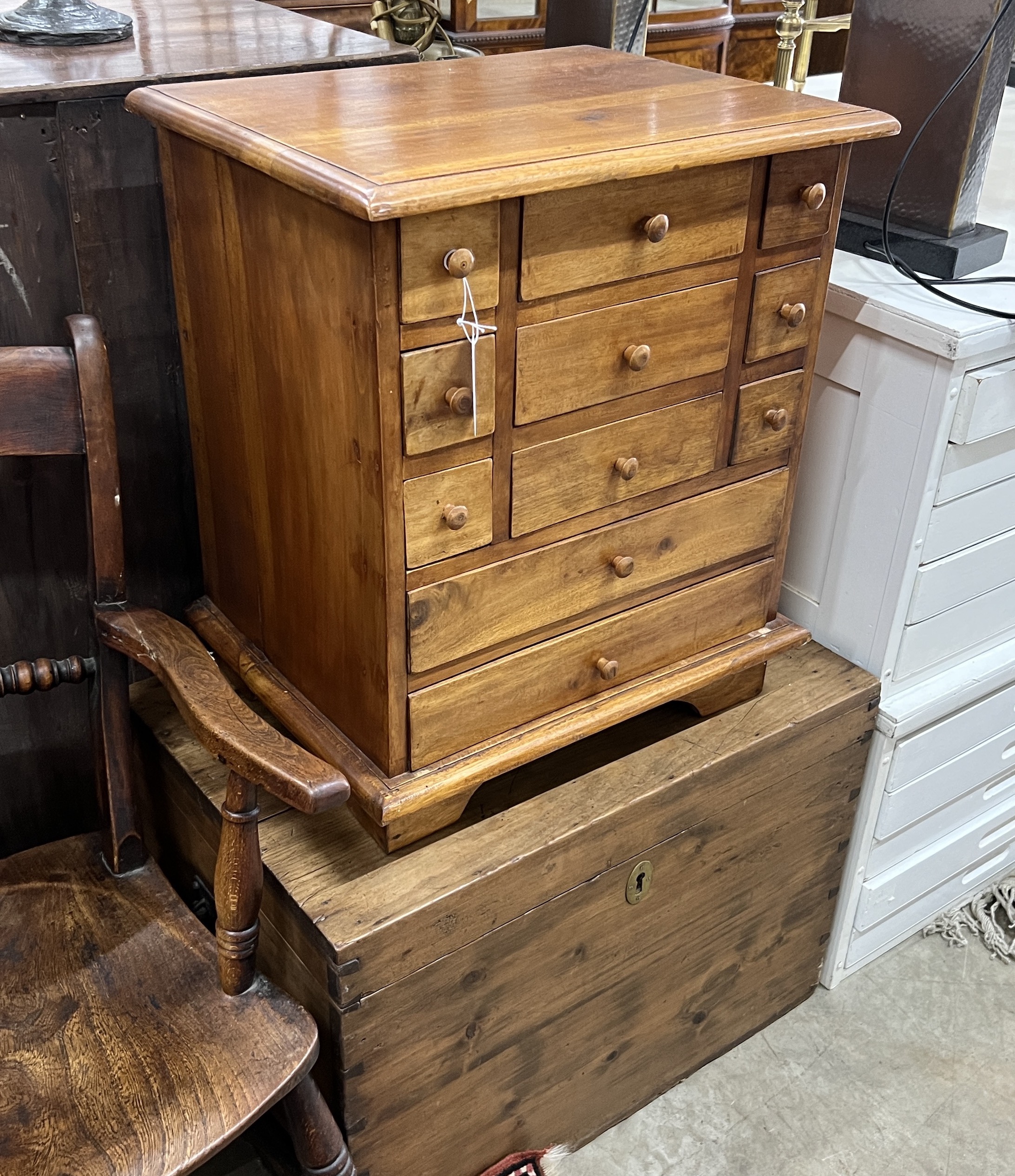 A small Victorian pine trunk, width 66cm, depth 44cm, height 47cm and a modern hardwood drawer unit